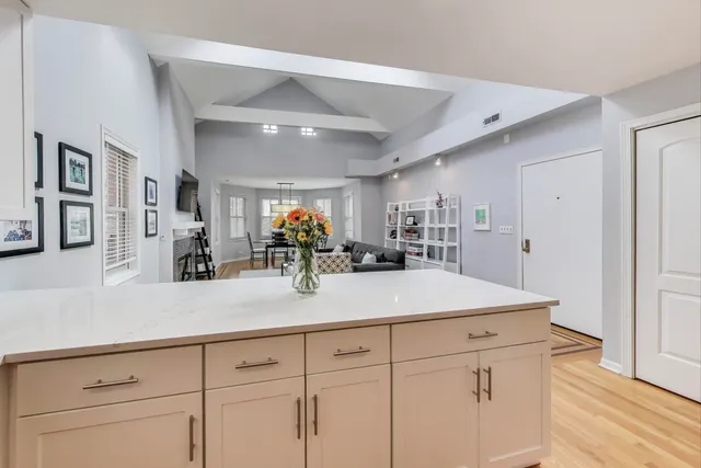 a view living room with granite countertop stainless steel appliances sink and cabinets