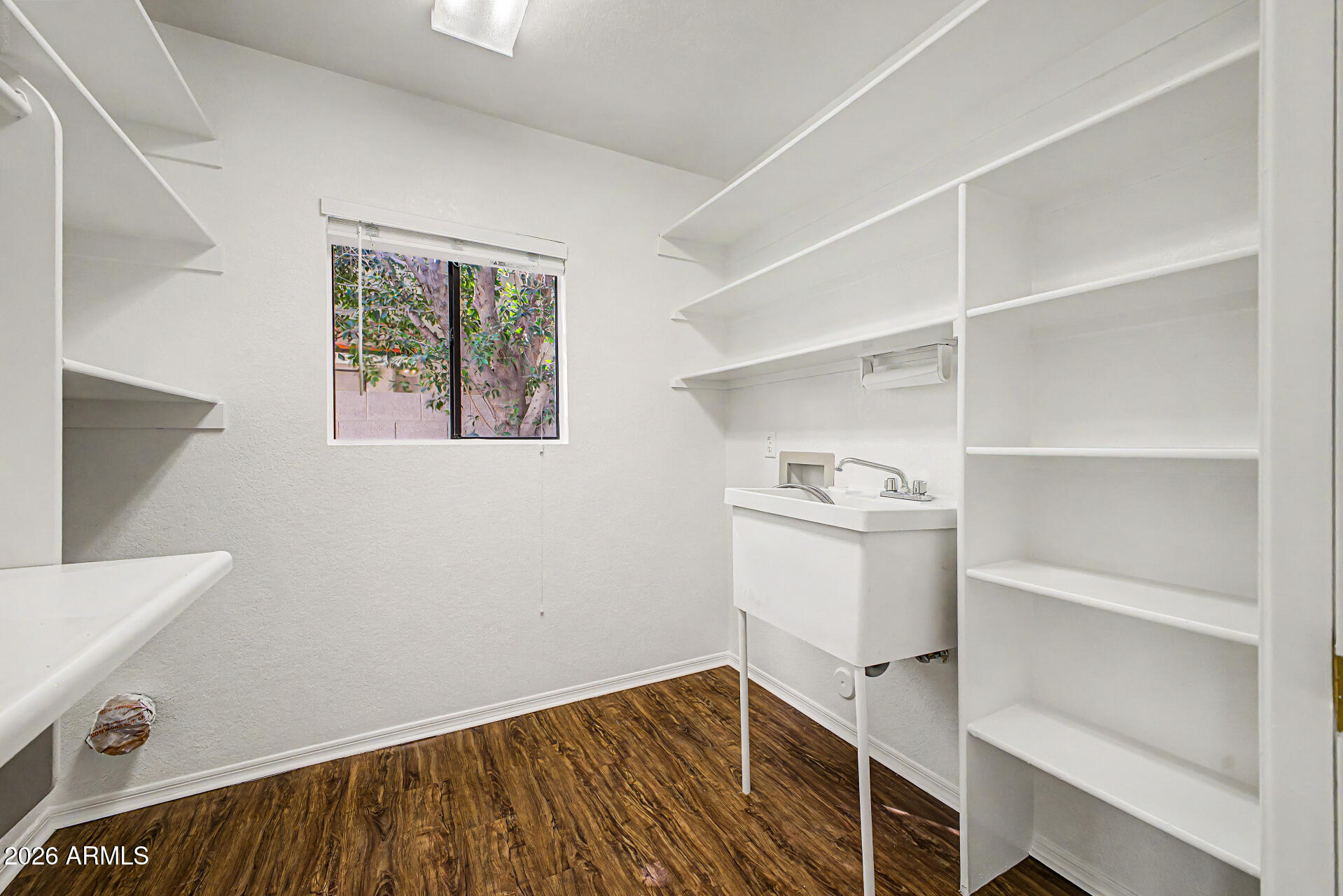 6725 West Utopia Road Glendale, AZ 85308 - Photo 11 of 27 a view of an empty room with empty racks