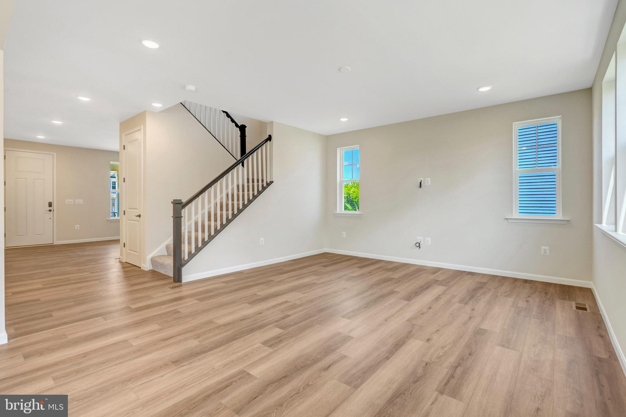 35670 Aspen Way Locust Grove, VA 22508 - Photo 11 of 60 a view of room with wooden floor and stairs