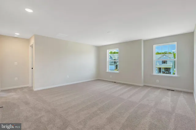 a bathroom with a sink double vanity granite tub shower and a mirror