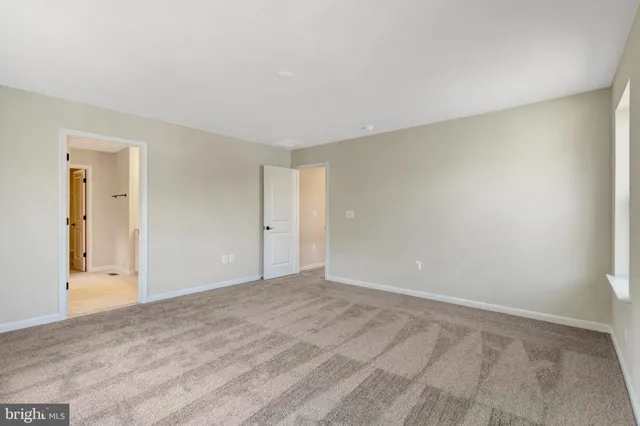 a view of a bathroom with mirror