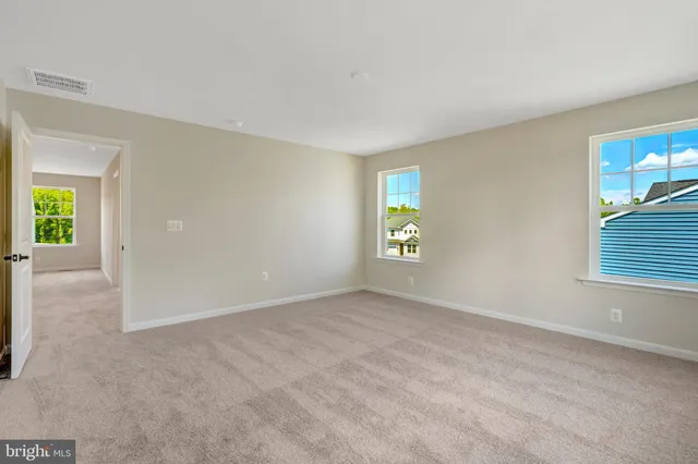 a view of a room with wooden walls