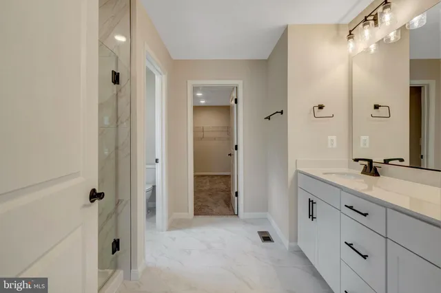 a view of an empty room with wooden walls