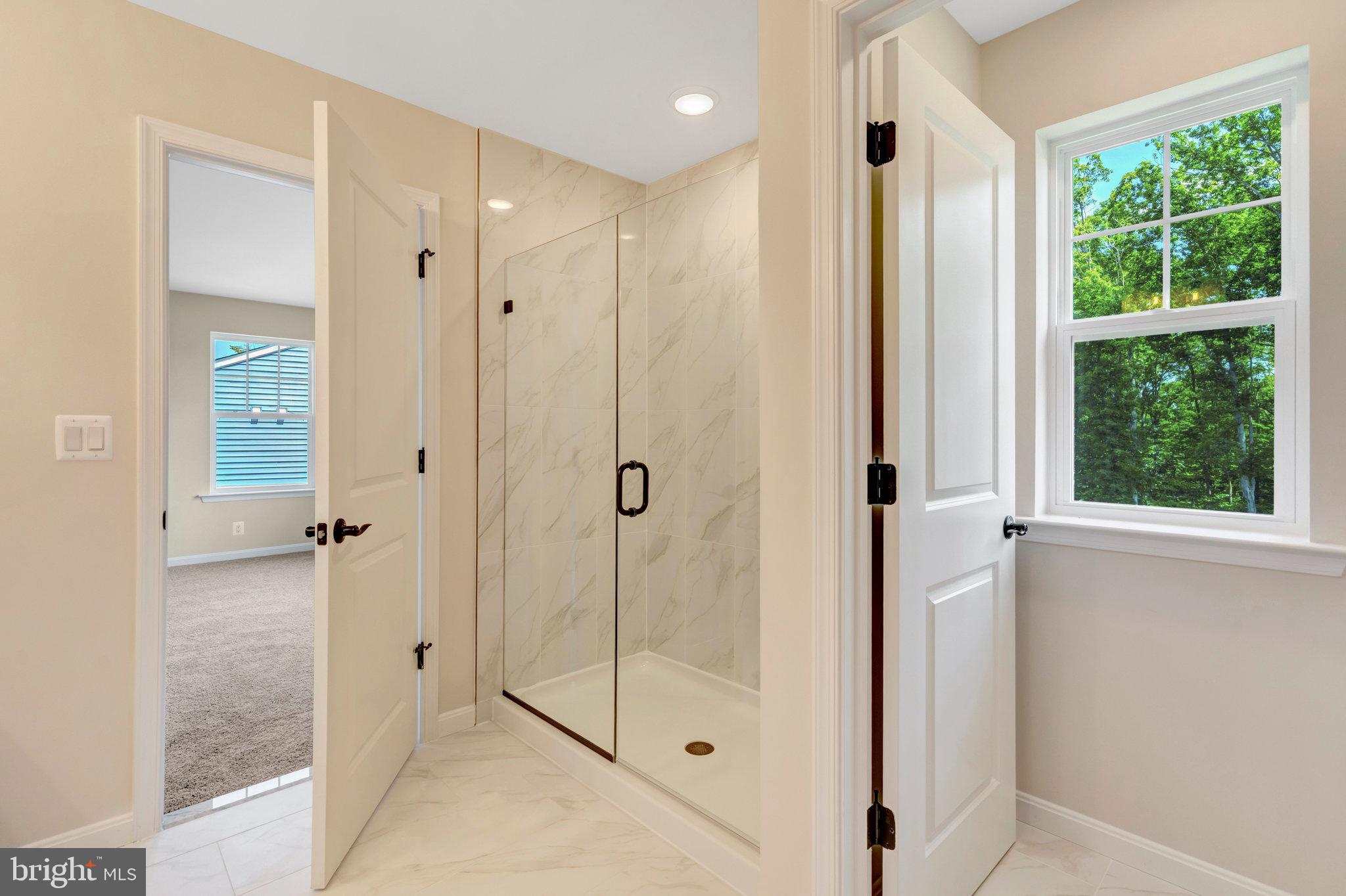 35670 Aspen Way Locust Grove, VA 22508 - Photo 42 of 60 a bathroom with a glass shower door