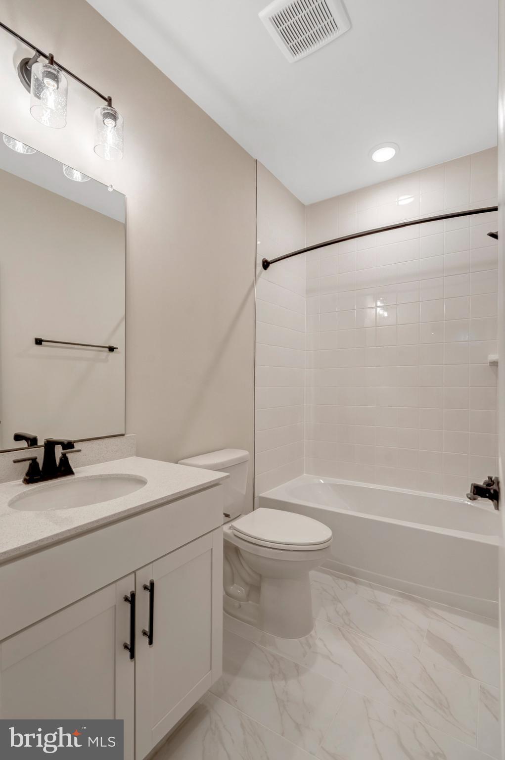 35670 Aspen Way Locust Grove, VA 22508 - Photo 47 of 60 a bathroom with a sink a toilet and shower