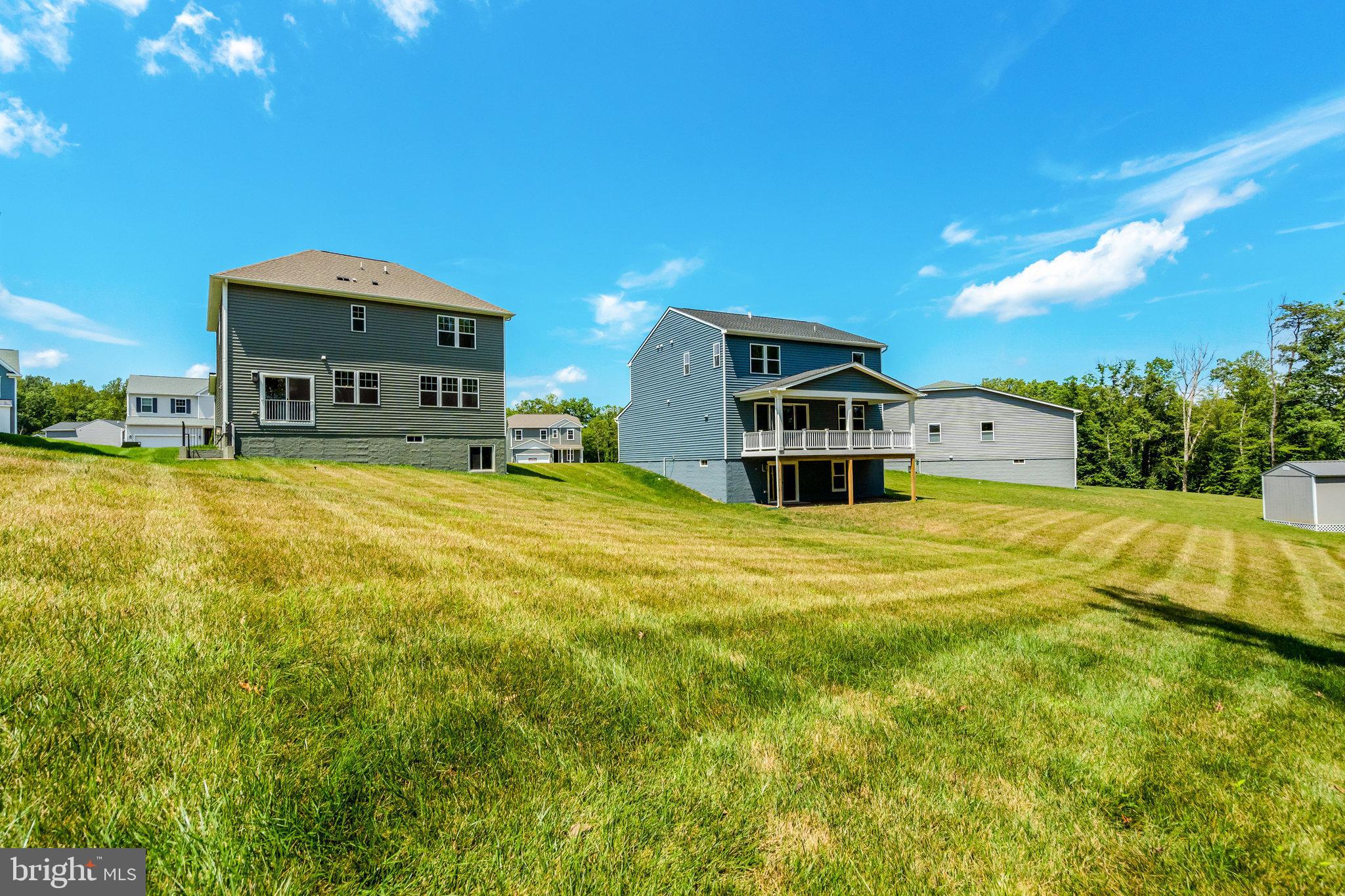 35670 Aspen Way Locust Grove, VA 22508 - Photo 58 of 60 a view of a house with a big yard and large trees