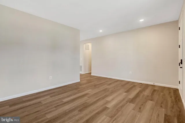 a view of entryway with wooden floor and stair
