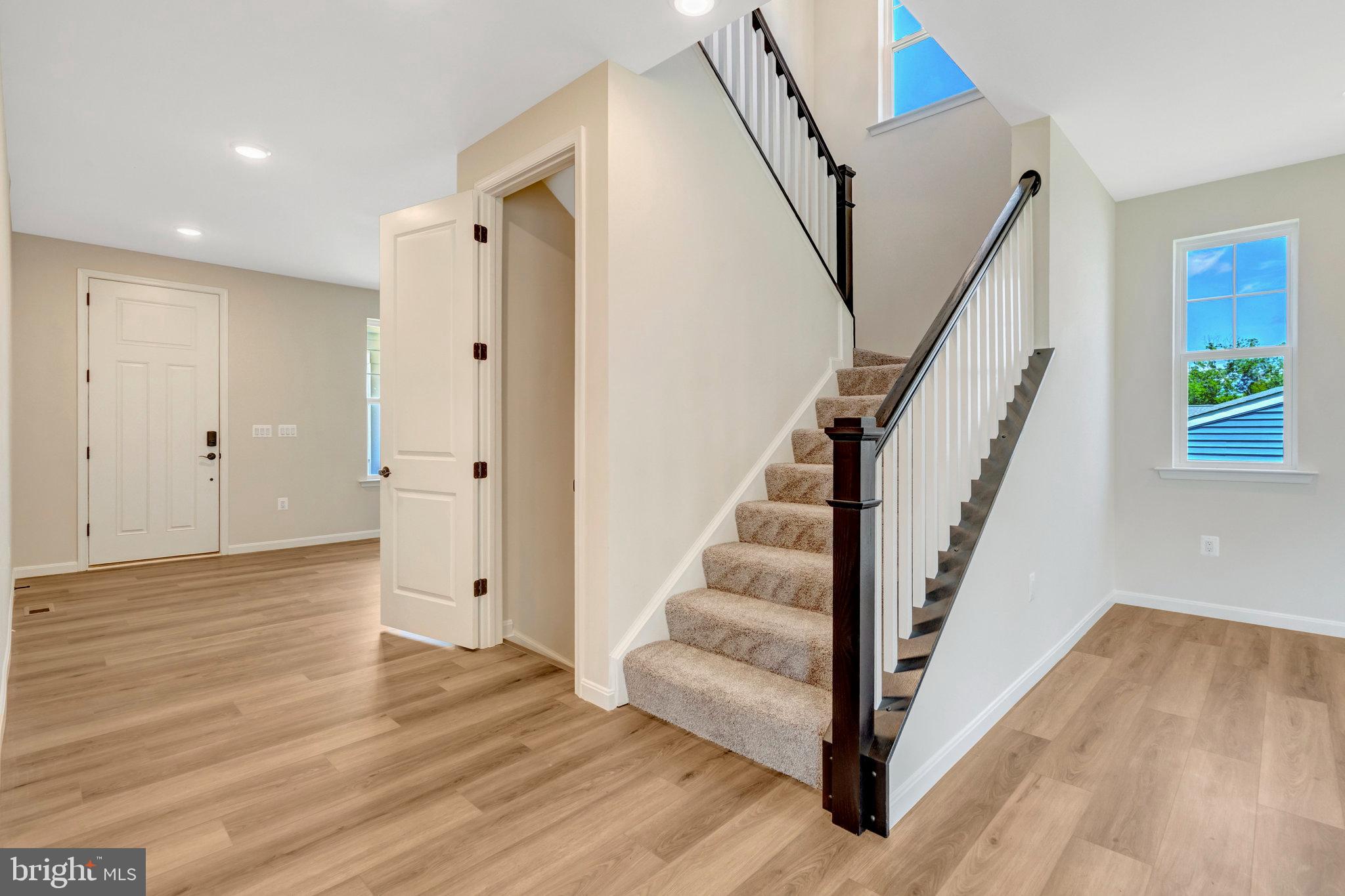 35670 Aspen Way Locust Grove, VA 22508 - Photo 10 of 60 a view of entryway with wooden floor and stair