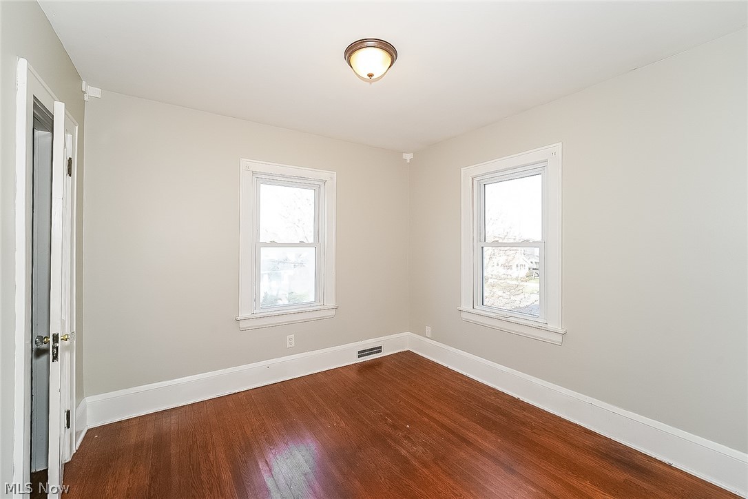 911 Dan Street Akron, OH 44310 - Photo 13 of 20 Spare room featuring dark hardwood / wood-style floors