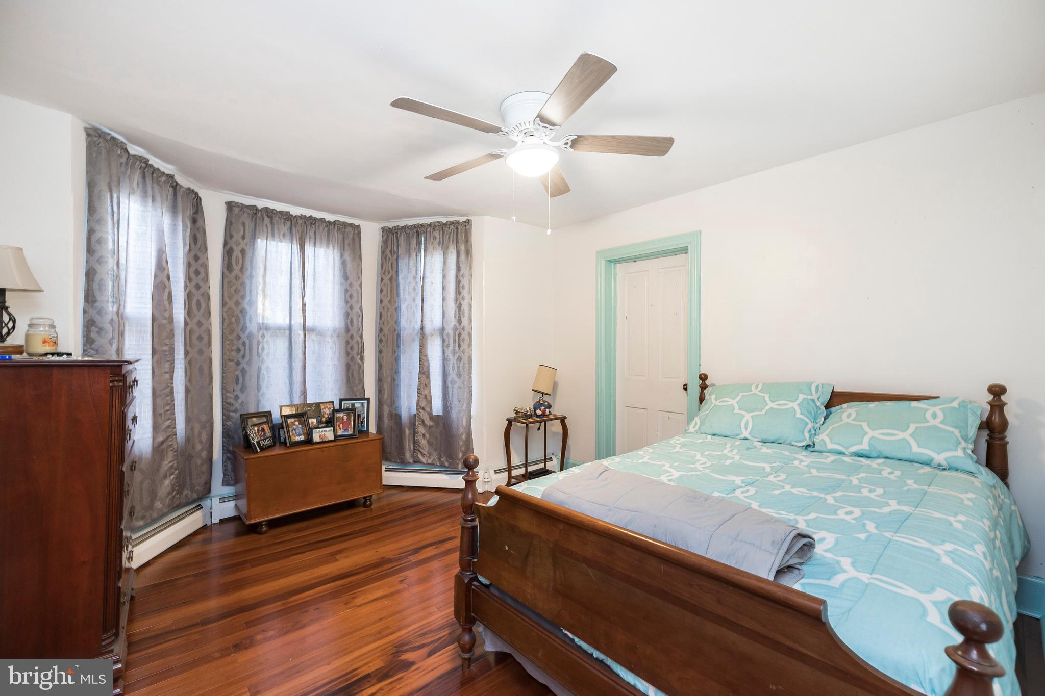 128 Chestnut Street Spring City, PA 19475 - Photo 19 of 32 a bedroom with a bed and a ceiling fan