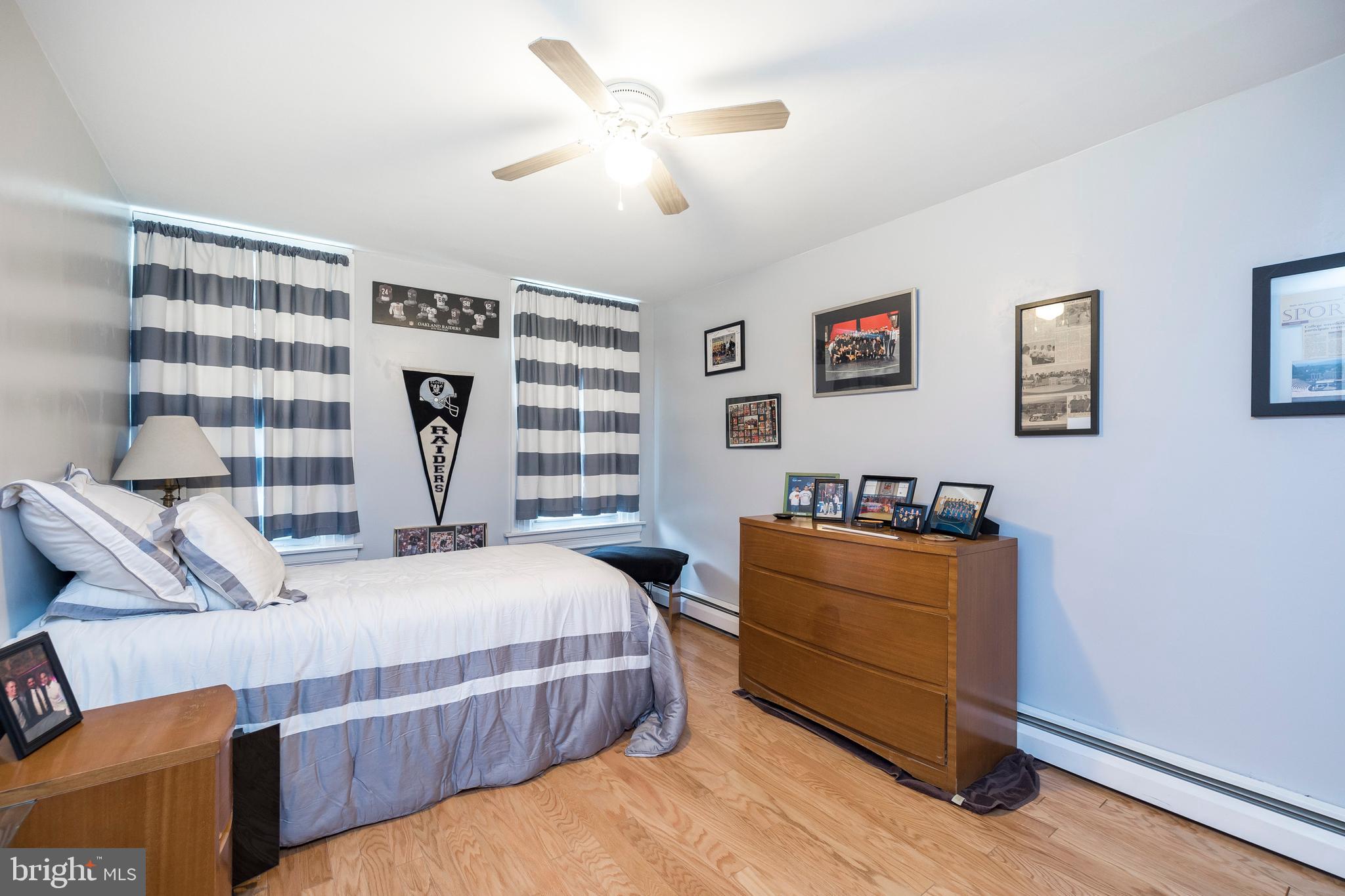 128 Chestnut Street Spring City, PA 19475 - Photo 21 of 32 a bedroom with a bed and wooden floor