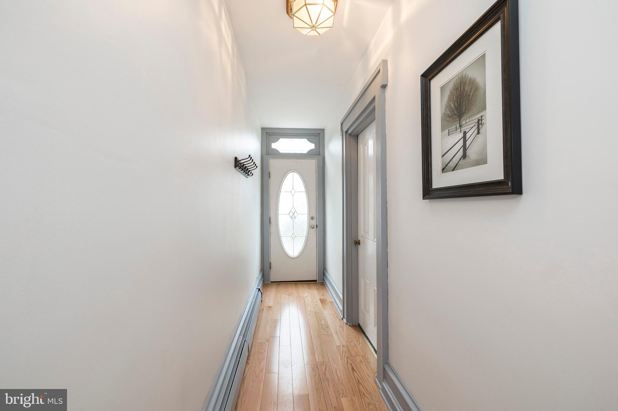 128 Chestnut Street Spring City, PA 19475 - Photo 4 of 32 a view of a hallway with wooden floor