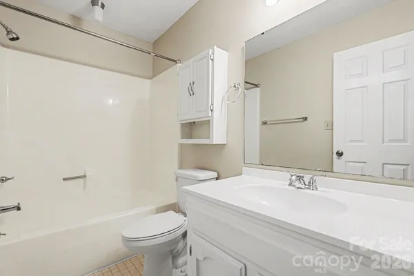 a bathroom with a sink vanity and a mirror