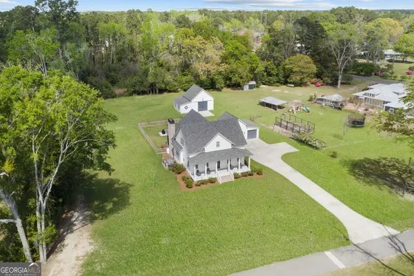 a view of a house with a big yard