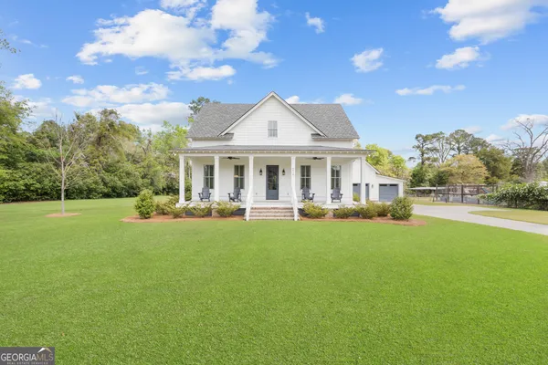 a view of house with yard and entertaining space