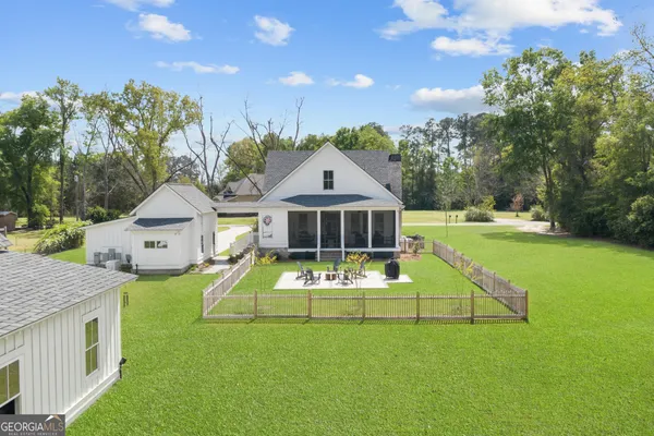 a front view of a house with yard and garage