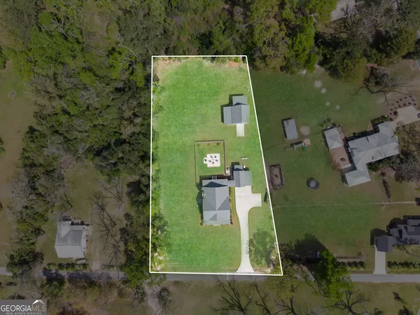 an aerial view of a house with a garden