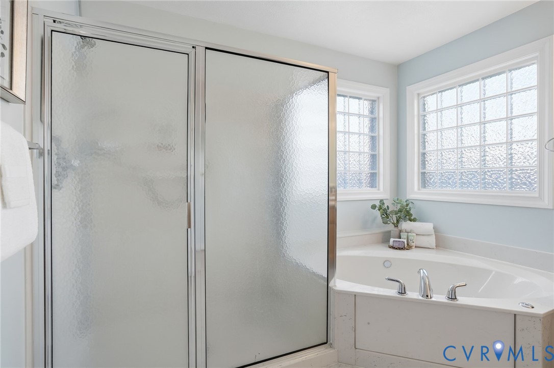 8420 Lee Davis Road Mechanicsville, VA 23116 - Photo 22 of 45 a bathroom with a bathtub and a shower