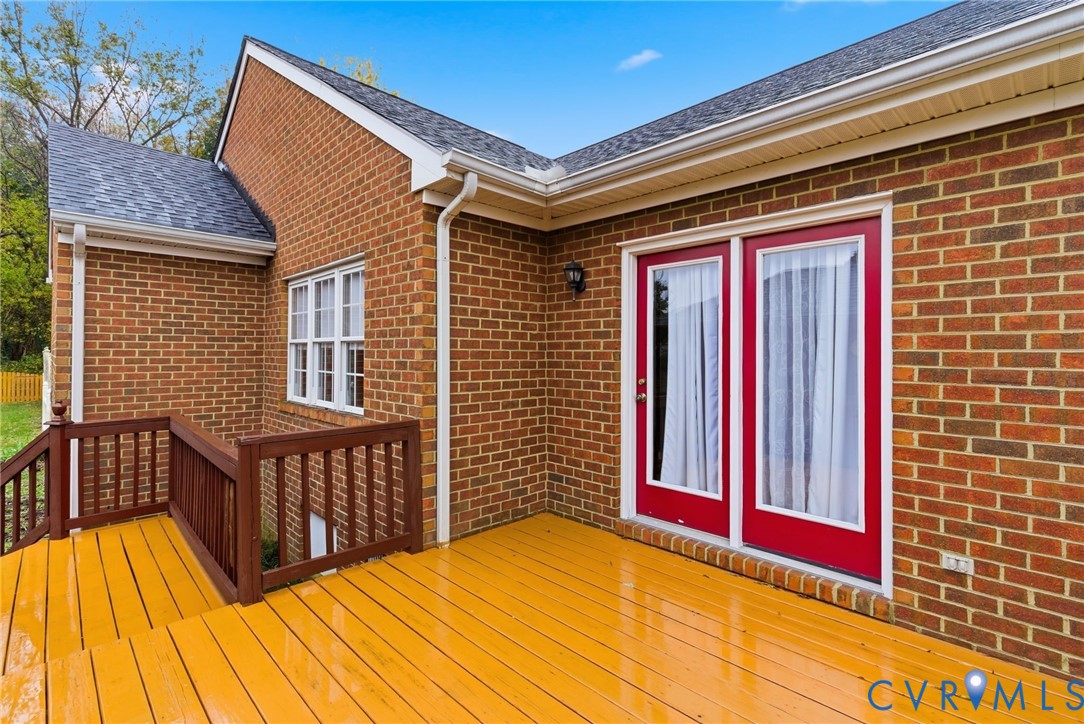 8420 Lee Davis Road Mechanicsville, VA 23116 - Photo 41 of 45 a view of a balcony with wooden floor and fence
