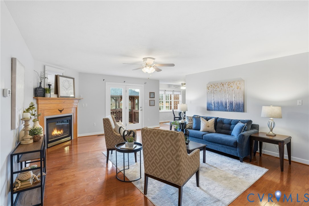 8420 Lee Davis Road Mechanicsville, VA 23116 - Photo 8 of 45 a living room with furniture a fireplace and a table