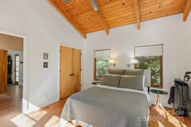 a bedroom with furniture and a window