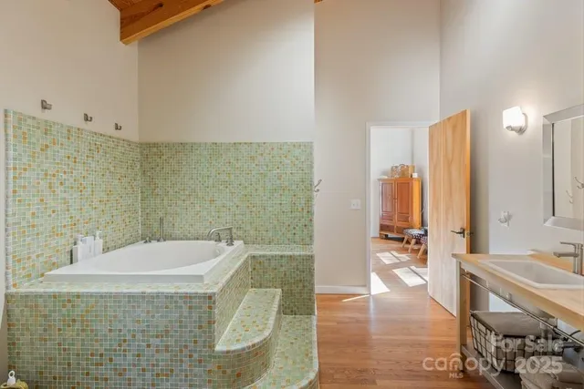 a bathroom with a bathtub and a sink