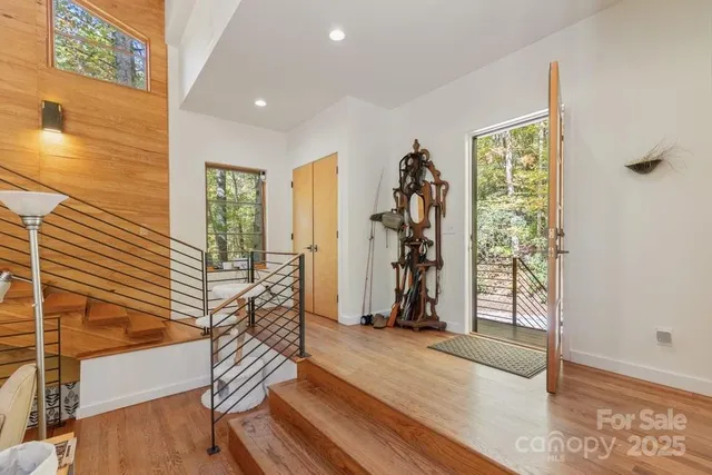a view of entryway with wooden floor and door