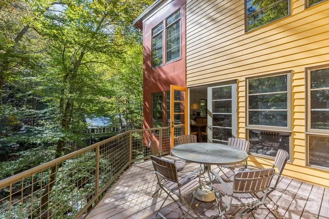 a view of a chair and table in the balcony