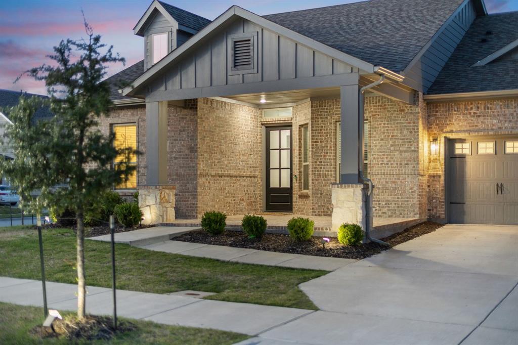8808 Royal Star Road Rowlett, TX 75089 - Photo 4 of 40 a front view of a house with garden