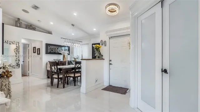 a view of a livingroom with furniture and a window