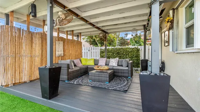 a view of a bench in backyard of house