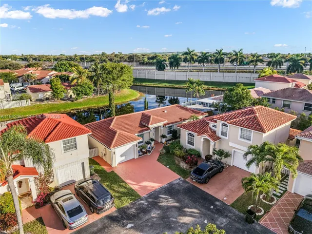 an aerial view of a house with a lake view