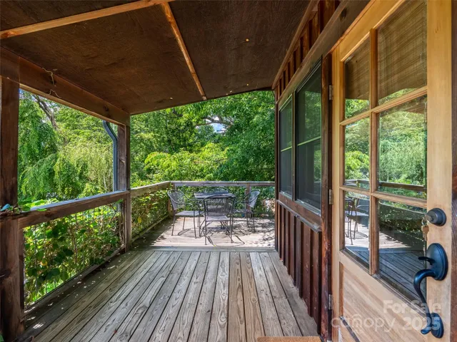 a view of a balcony with wooden floor