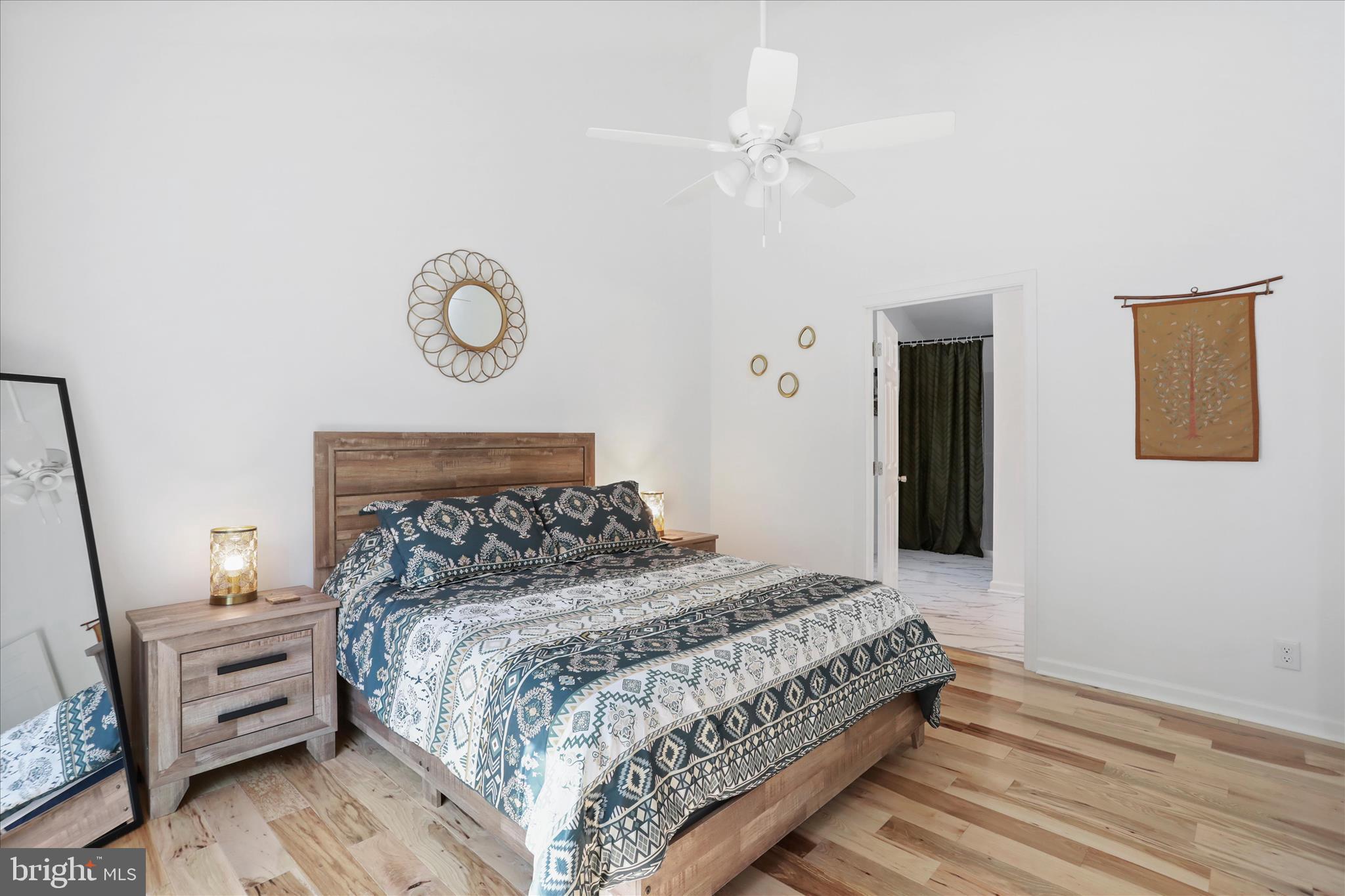 598 Crabapple Road Mount Jackson, VA 22842 - Photo 10 of 32 a bedroom with a bed and a chandelier