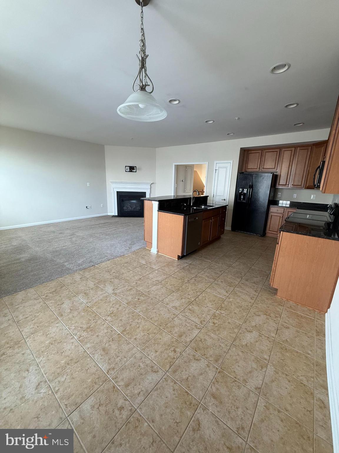 202 B Mill Pond Road Frederick, MD 21701 - Photo 12 of 44 a living room with furniture and a chandelier