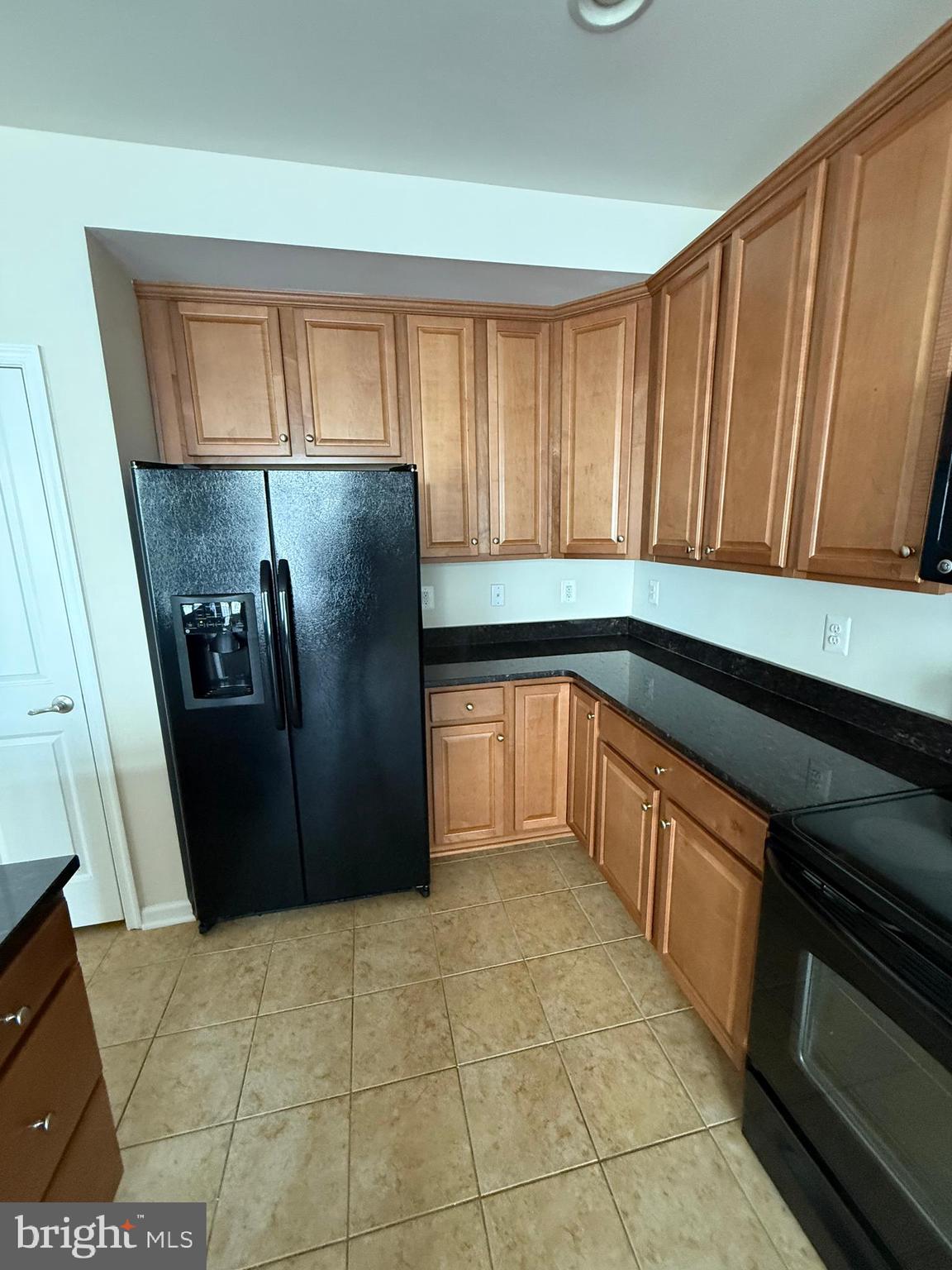 202 B Mill Pond Road Frederick, MD 21701 - Photo 16 of 44 a kitchen with stainless steel appliances granite countertop a refrigerator and a sink