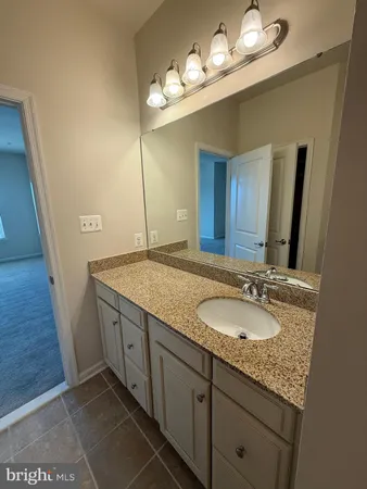 a bathroom with a shower and a sink