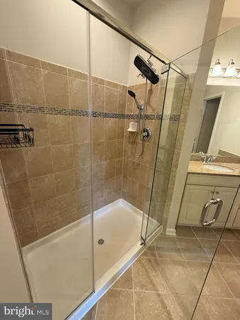 a bathroom with a tub and a shower