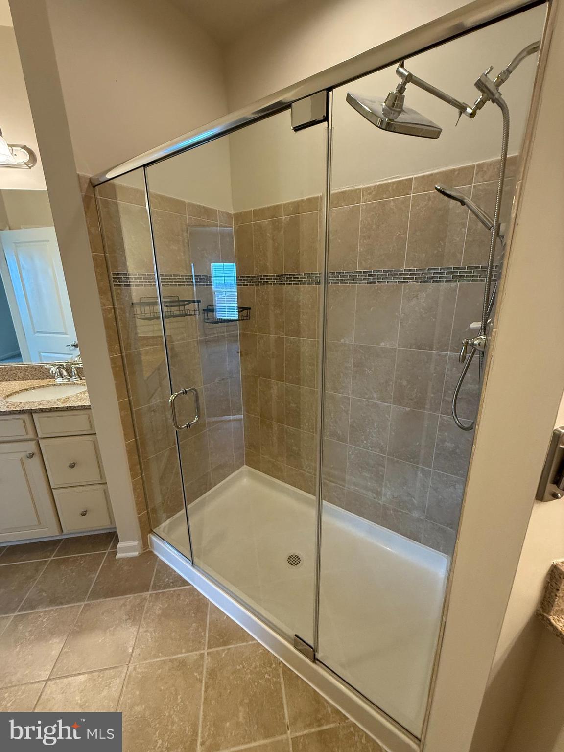 202 B Mill Pond Road Frederick, MD 21701 - Photo 28 of 44 a bathroom with a shower and a sink