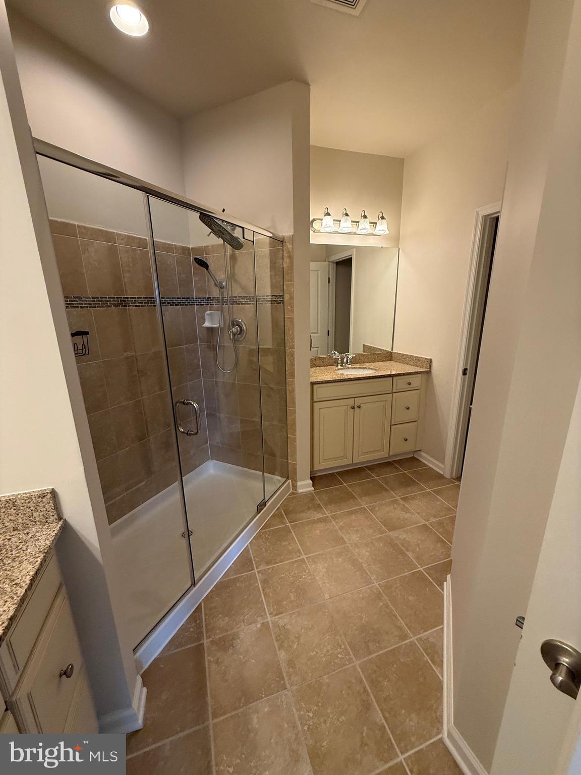 202 B Mill Pond Road Frederick, MD 21701 - Photo 29 of 44 a bathroom with a tub and a shower