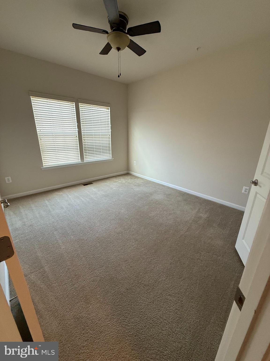 202 B Mill Pond Road Frederick, MD 21701 - Photo 42 of 44 an empty room with windows and fan