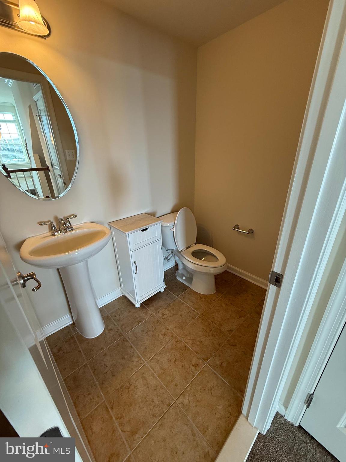 202 B Mill Pond Road Frederick, MD 21701 - Photo 7 of 44 a bathroom with a sink and a mirror