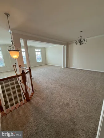 a view of a livingroom with furniture and windows