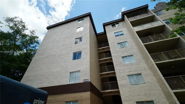a front view of a house with large windows