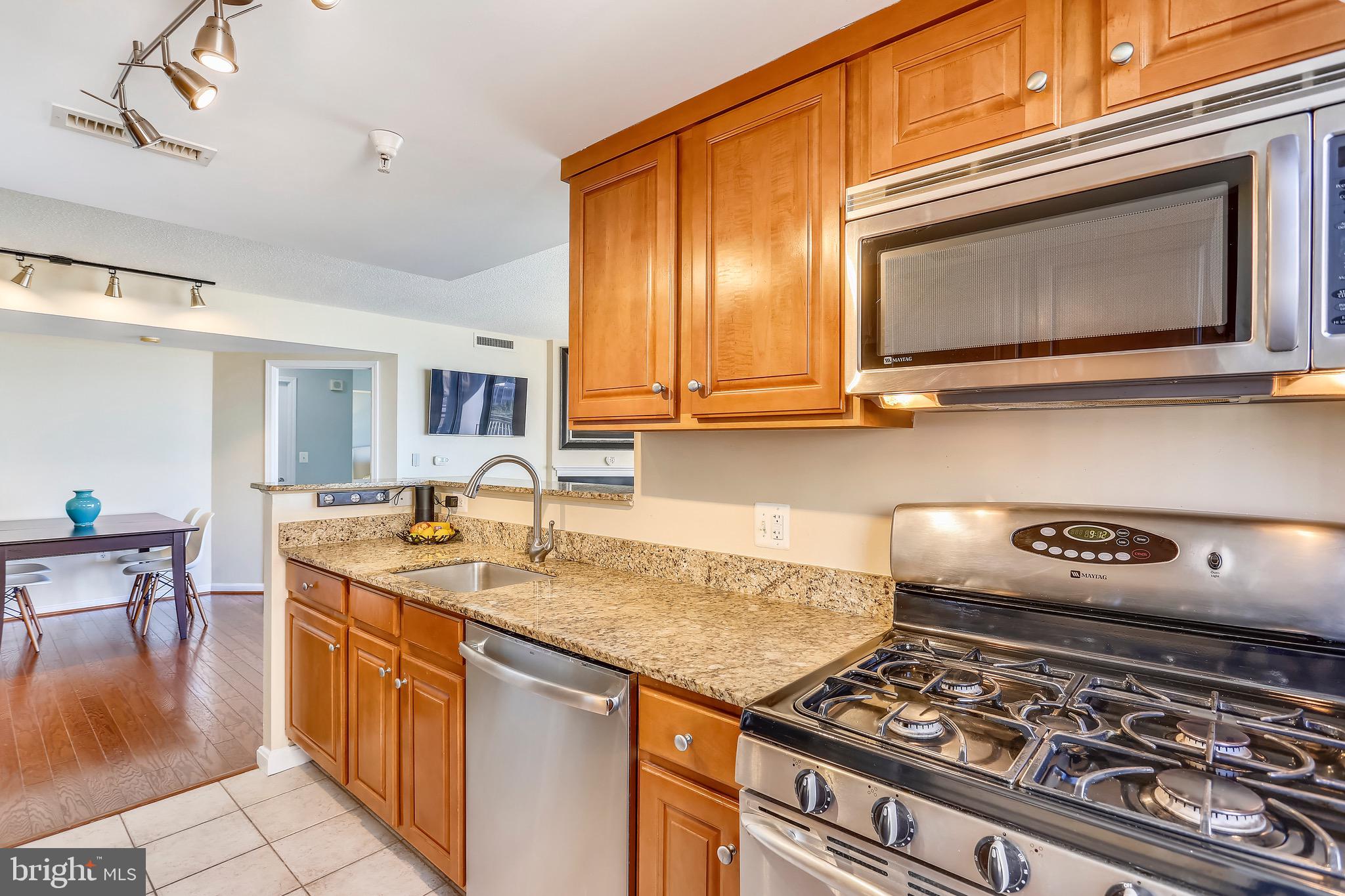 11710 Old Georgetown Road, Unit 901 North Bethesda, MD 20852 - Photo 6 of 32 Kitchen open to dining area and living space