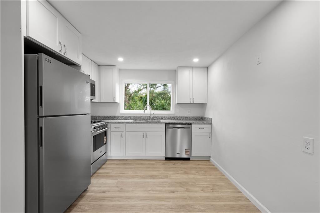 203 Skyport Road West Mifflin, PA 15122 - Photo 12 of 29 All new appliances, granite counters, backsplash and cabinetry