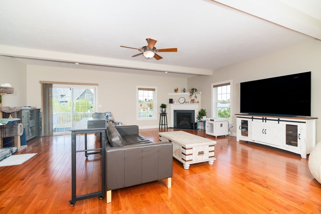 51 Tamarack Road Dracut, MA 01826 - Photo 7 of 39 a living room with furniture and a flat screen tv