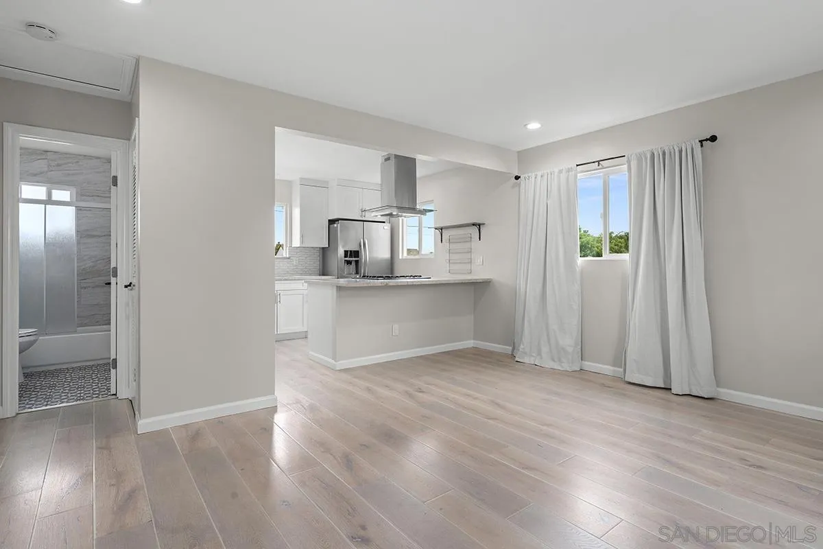 3539 Granada Avenue San Diego, CA 92104 - Photo 17 of 35 a view of a kitchen with wooden floor and a sink