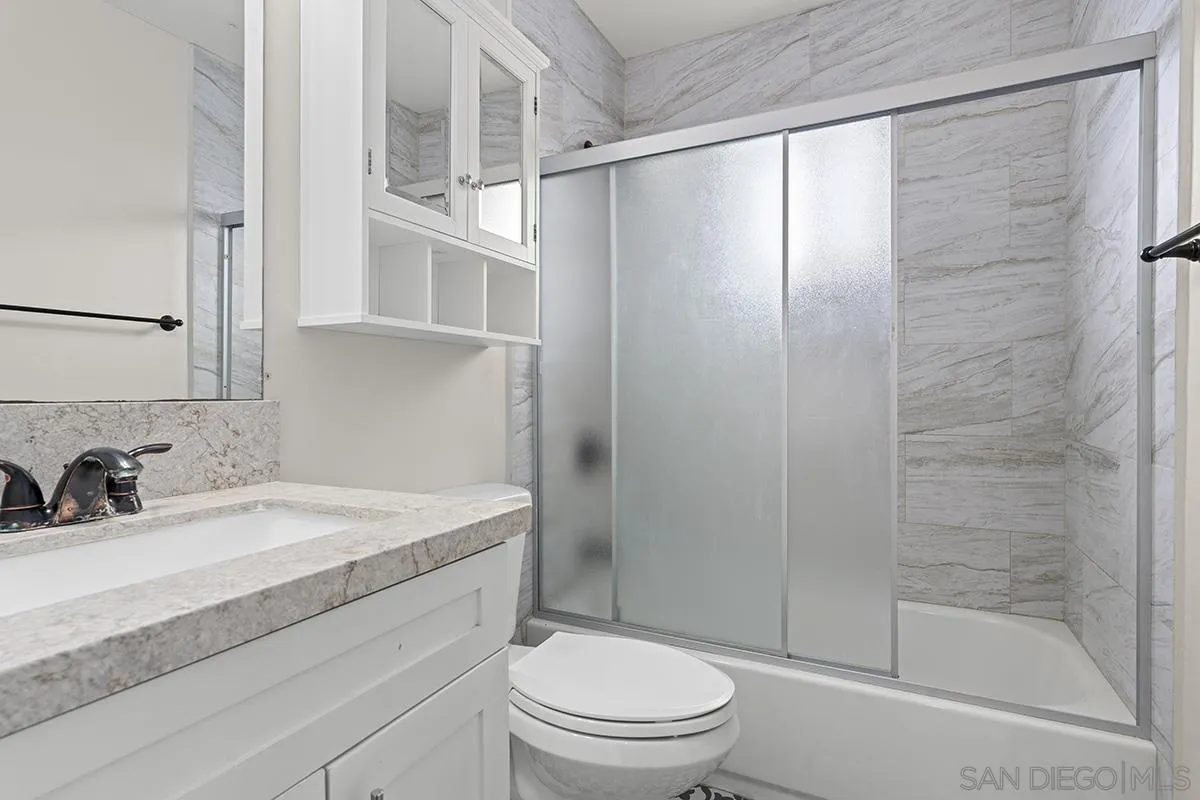 3539 Granada Avenue San Diego, CA 92104 - Photo 21 of 35 a bathroom with a sink toilet and shower
