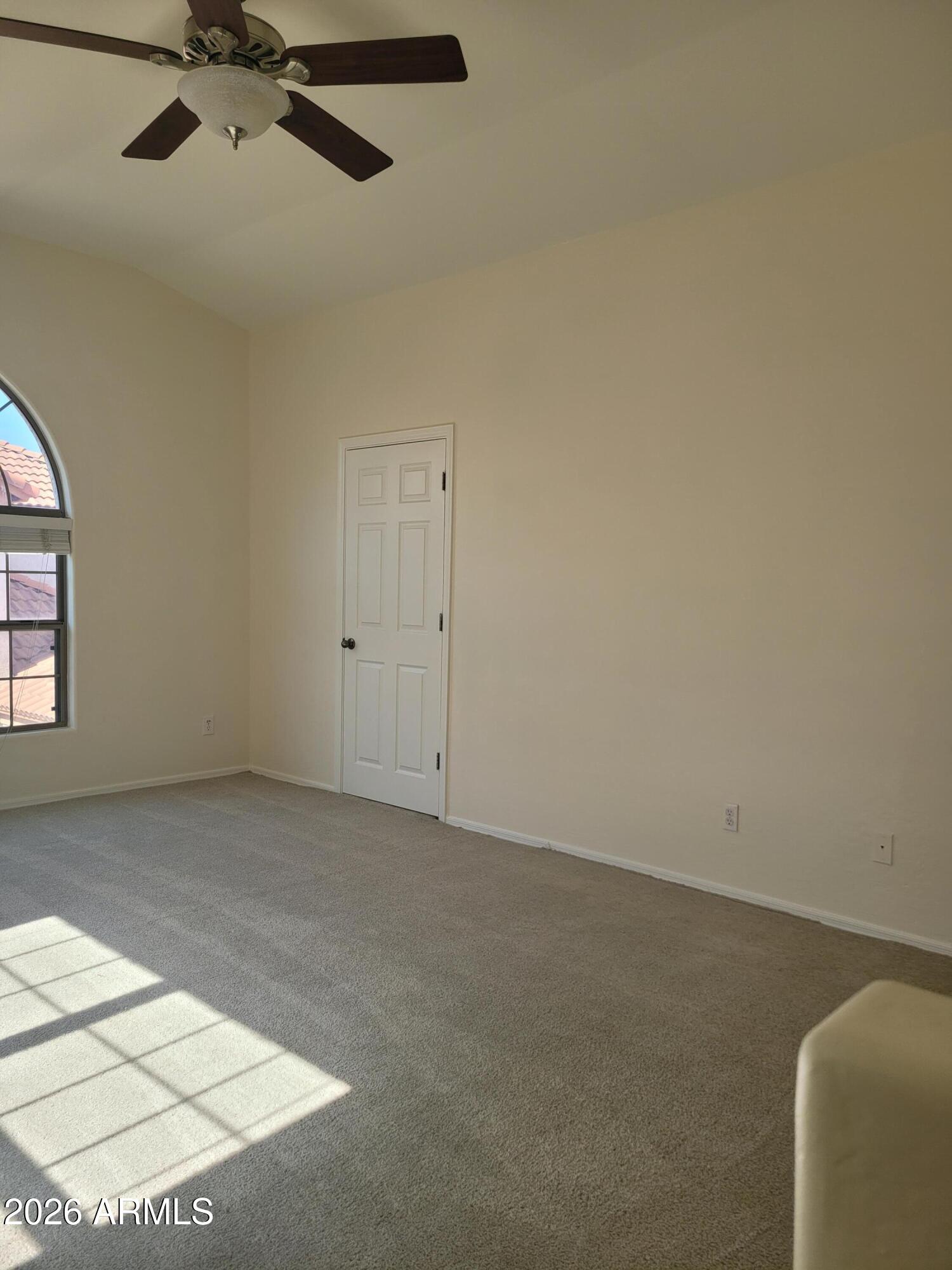 1453 South Sinova Avenue Gilbert, AZ 85296 - Photo 39 of 46 an empty room with a ceiling fan and window